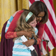 Michelle Obama hugs Charlotte Bell, 10, after she gave the first lady a copy of her father’s resume. Charlotte’s father has been out of work for three years.
SAUL LOEB/AFP/Getty Images